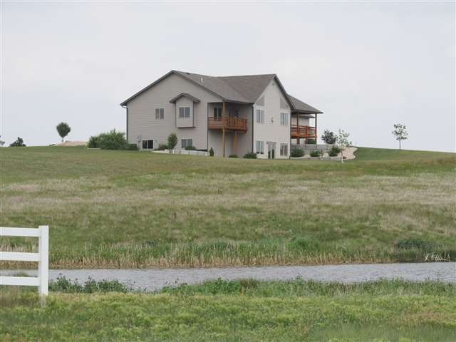Home is situated on 7.77 acres with a pond!  Enjoy