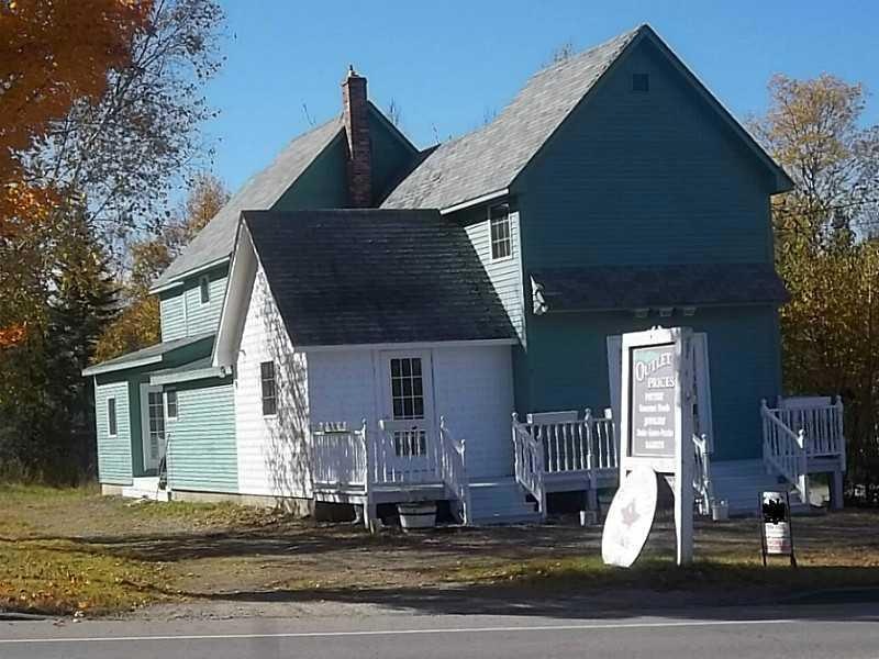 Exterior Front. Large house expanded...