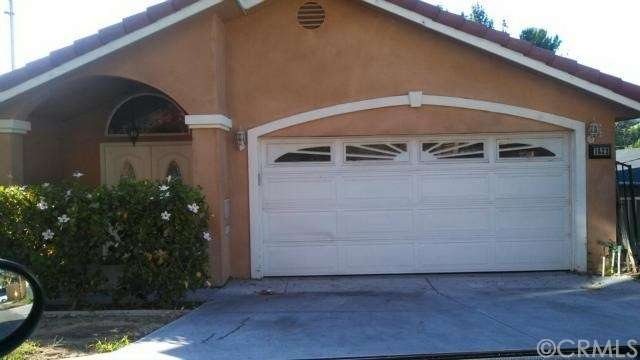 UPPER LEVEL ENTRANCE WITH 2 CAR GARAGE