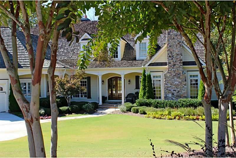 Exterior Front. Lush landscaping highlights the fr