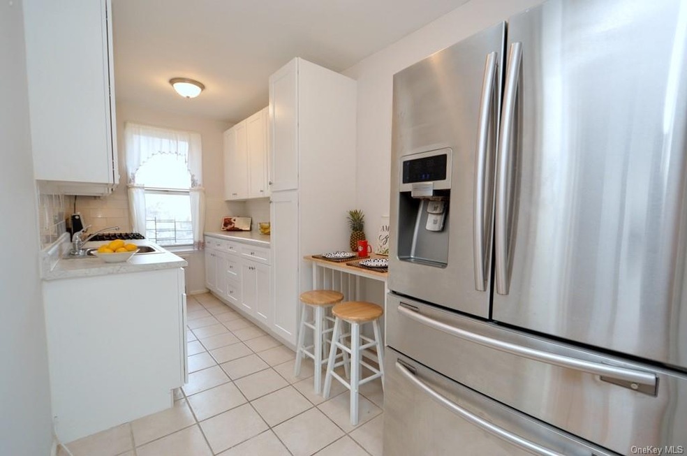 Updated Eat-in-Kitchen with stainless steel applia