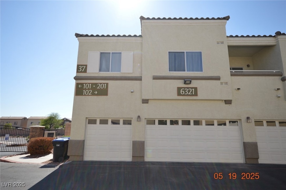 View of building exterior featuring a garage