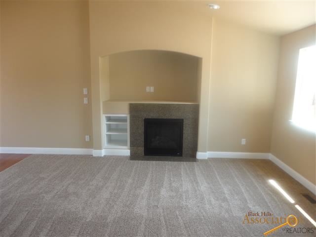 Beautiful granite surround gas fireplace with buil