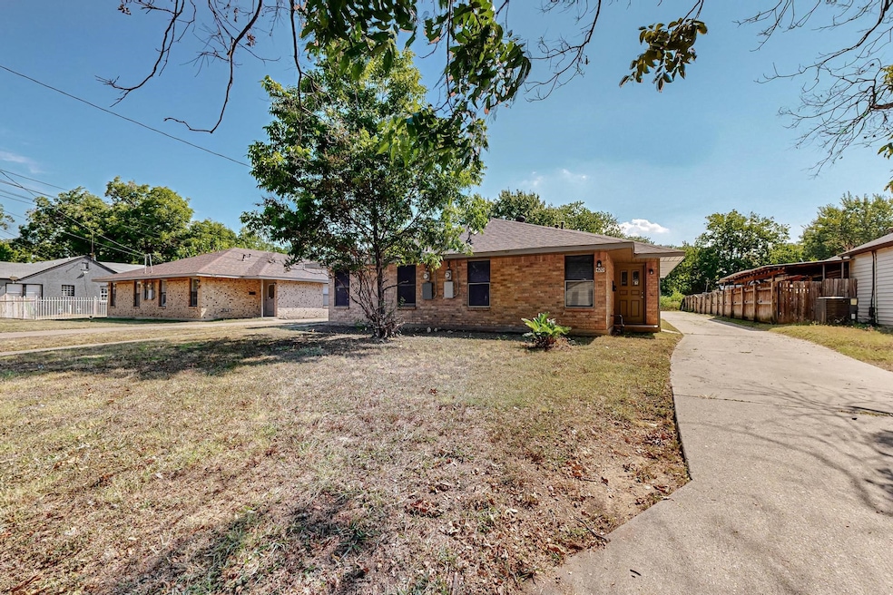 Single story home featuring brick siding, concrete driveway, and a shingled roof