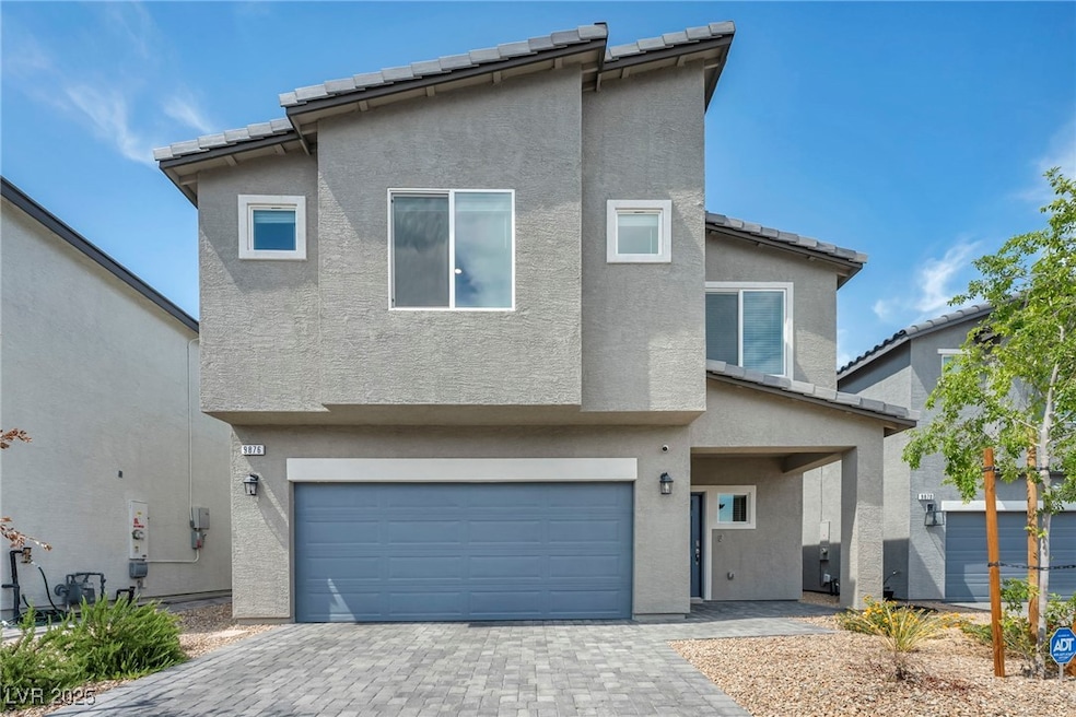 View of front of home featuring stucco siding, an