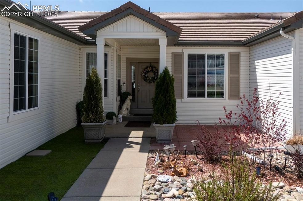 Ranch-style house featuring a tile roof, a garage,