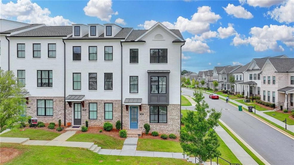 View of front of home featuring brick siding, a residential view, and a front yard