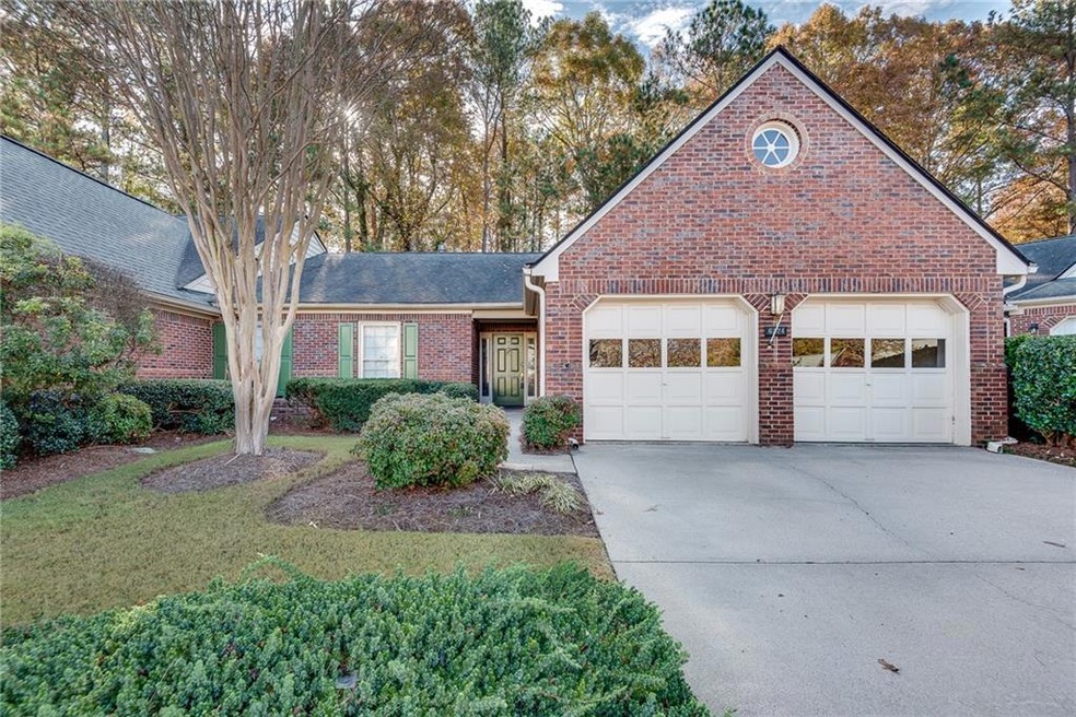 Brick beauty with remote controlled garage doors a