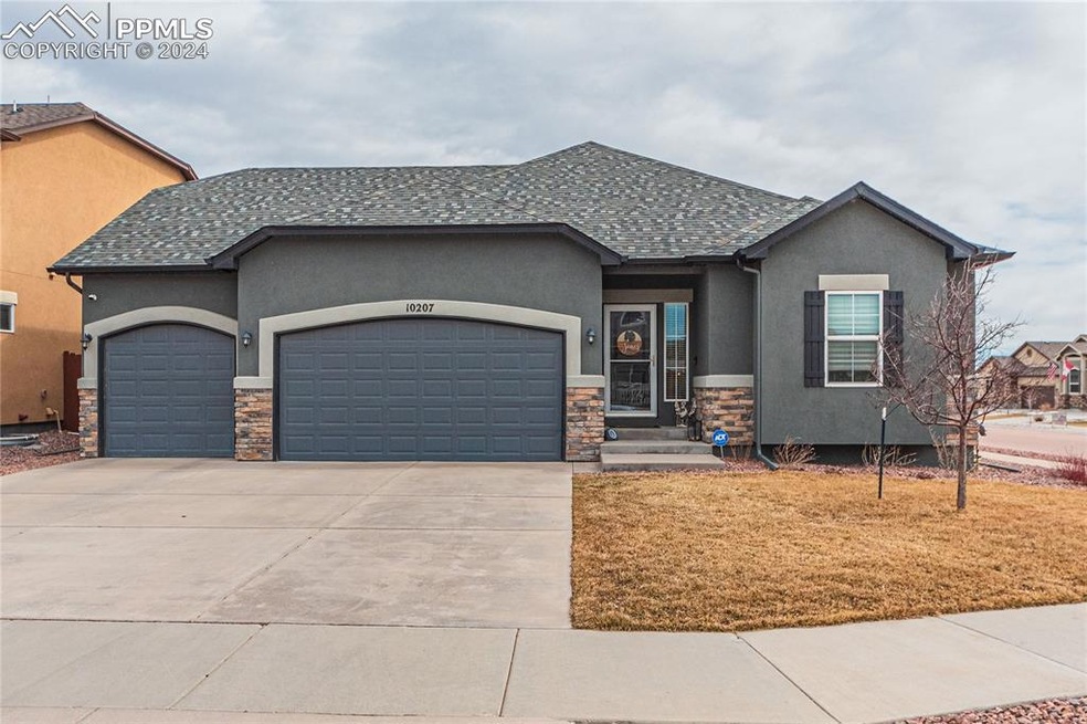 View of front of property featuring a garage