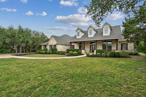 View of front of property with covered porch, a f