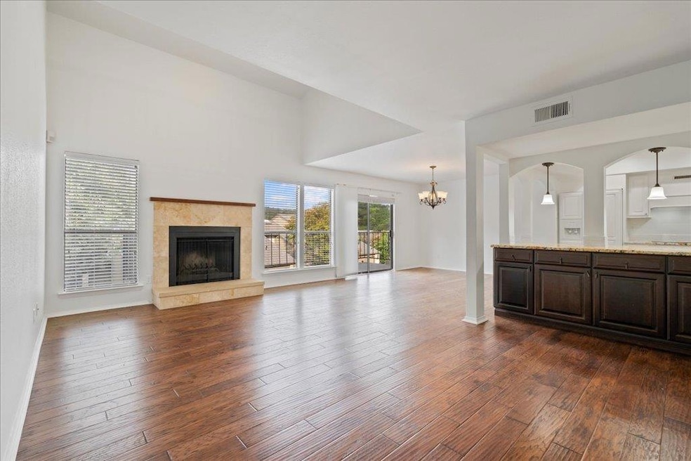 Unfurnished living room featuring dark wood finis