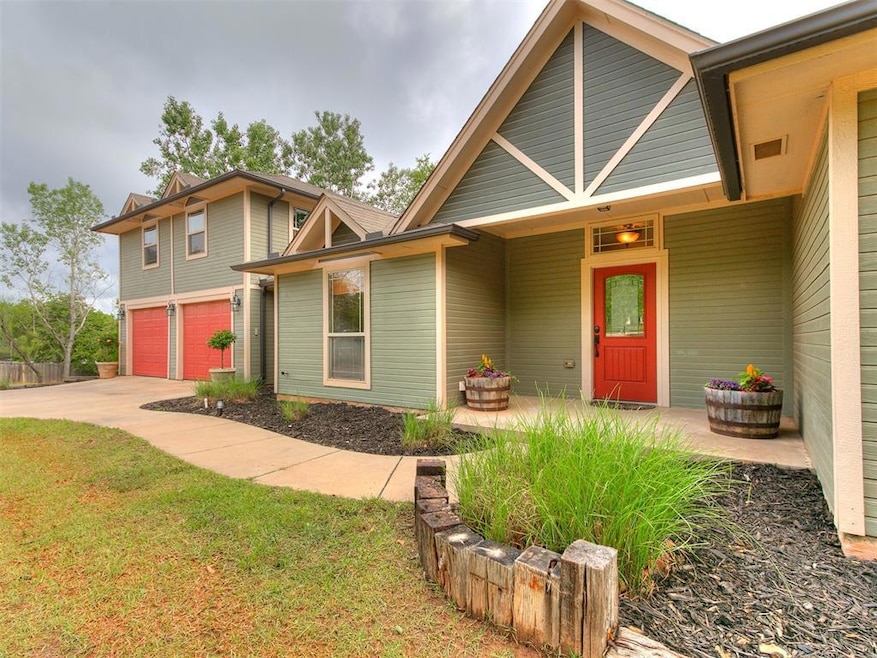 View of front of home featuring a garage, driveway