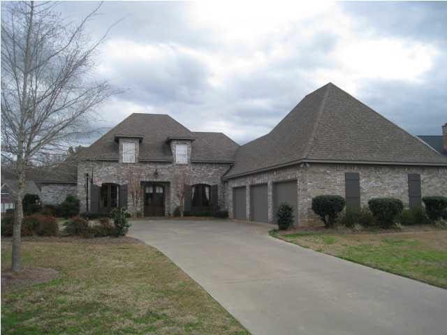 Front of home with 3 car garage.