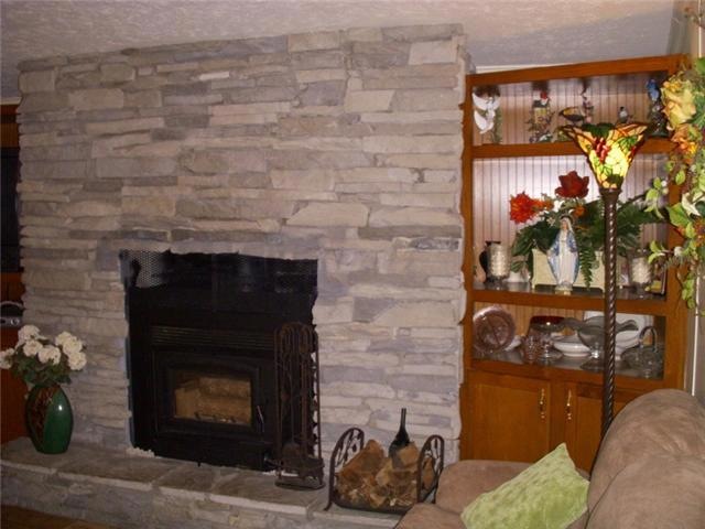Cuddle up and get Cozy in front of this lovely stacked stone fireplace on cold winter evenings.
