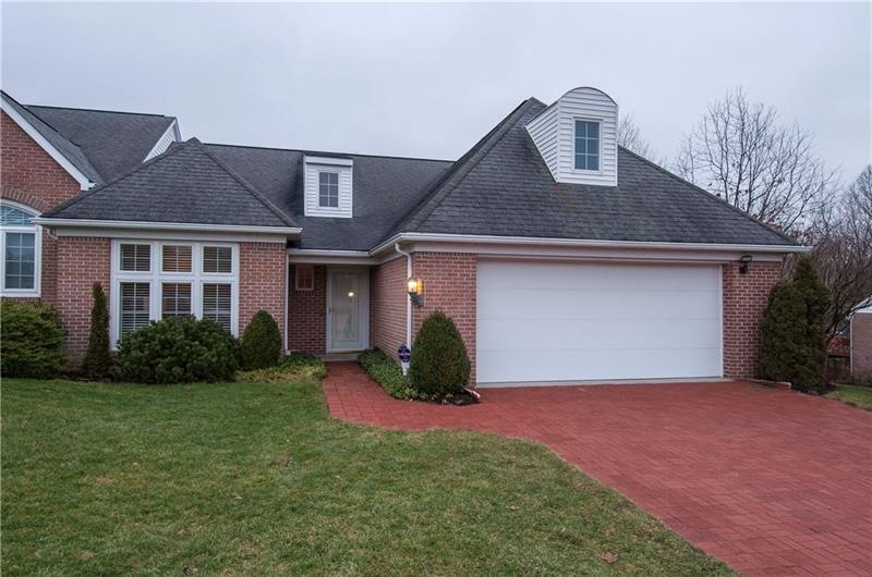 Stunning, well-maintained brick townhome.