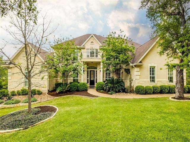 Meticulously maintained lawn and mature landscapin