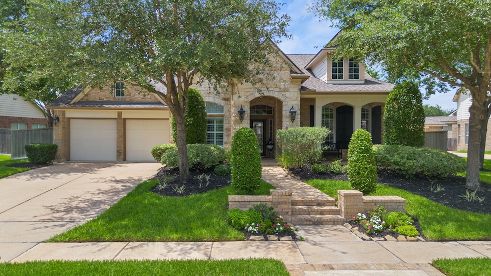 Featuring a stunning stone and brick exterior, thi