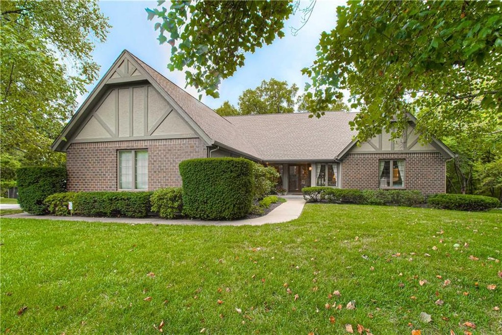 Brick and stucco charm in a park-like setting.
