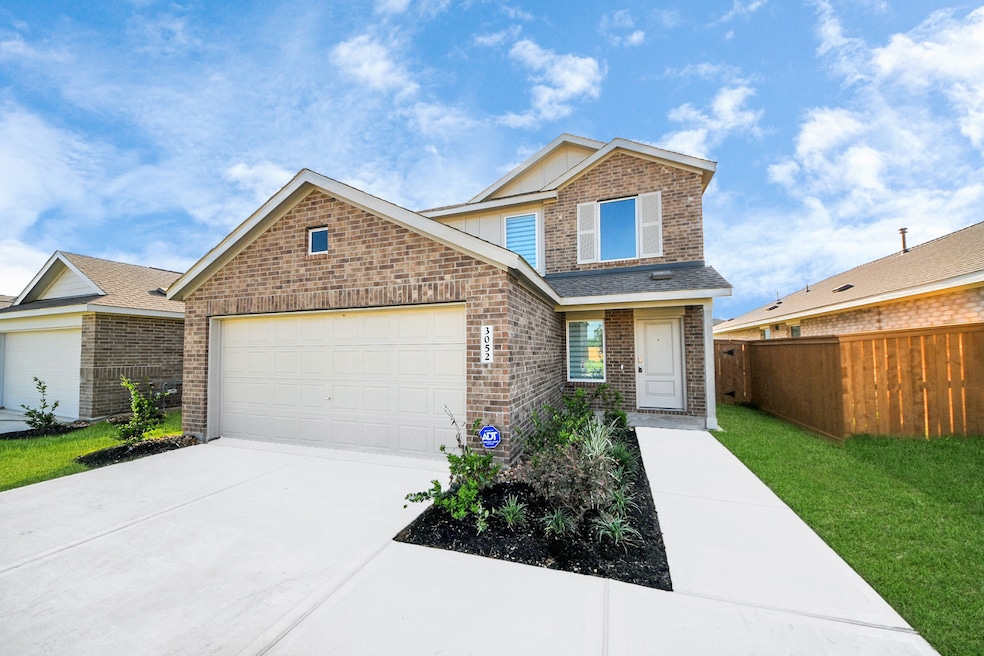 This modern two-story brick home has a clean, invi