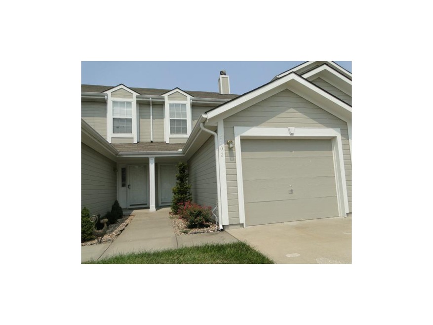 Front entry nicely landscaped and yard has own spr
