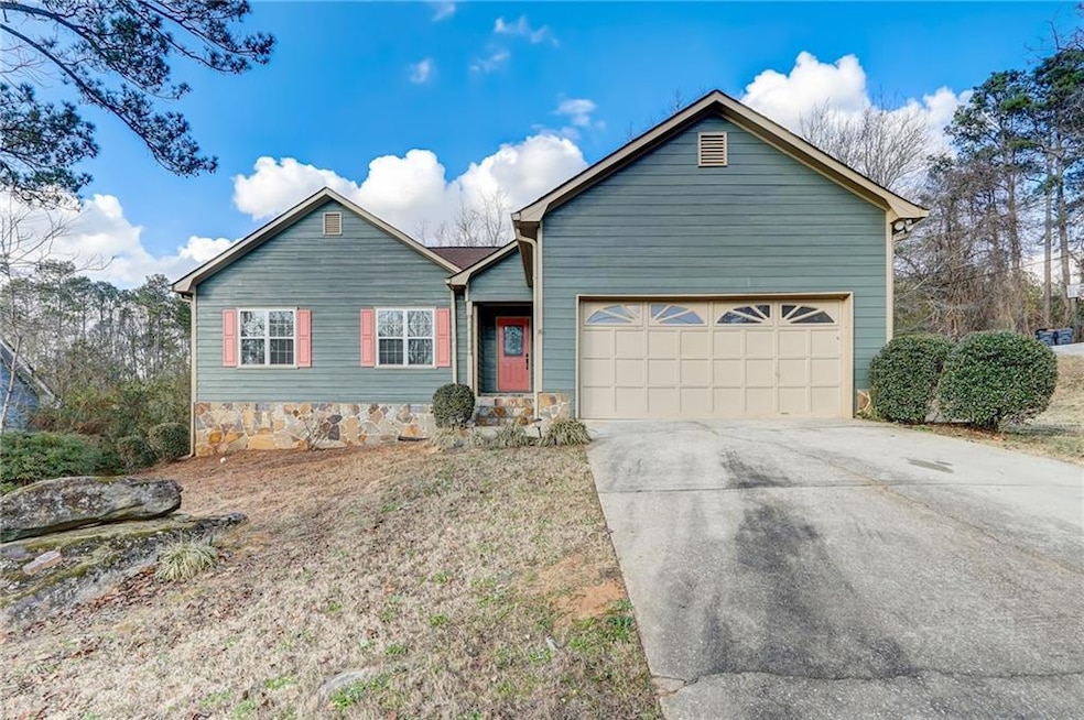 View of front of property featuring a garage