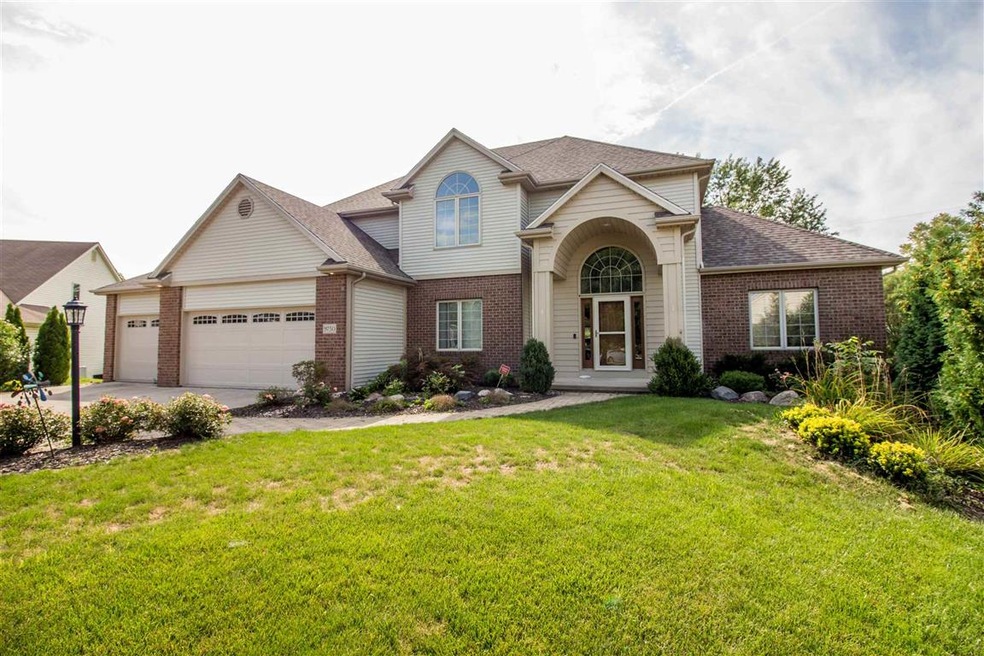 Nicely landscaped lot with 3.5 car garage