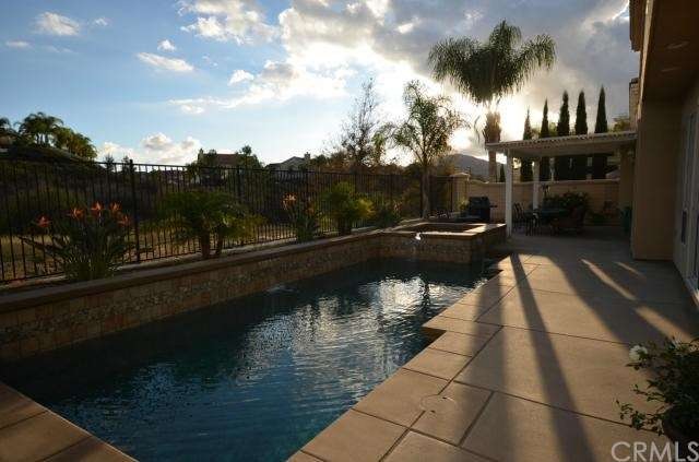 Custom salt water pebble tec pool with water featu