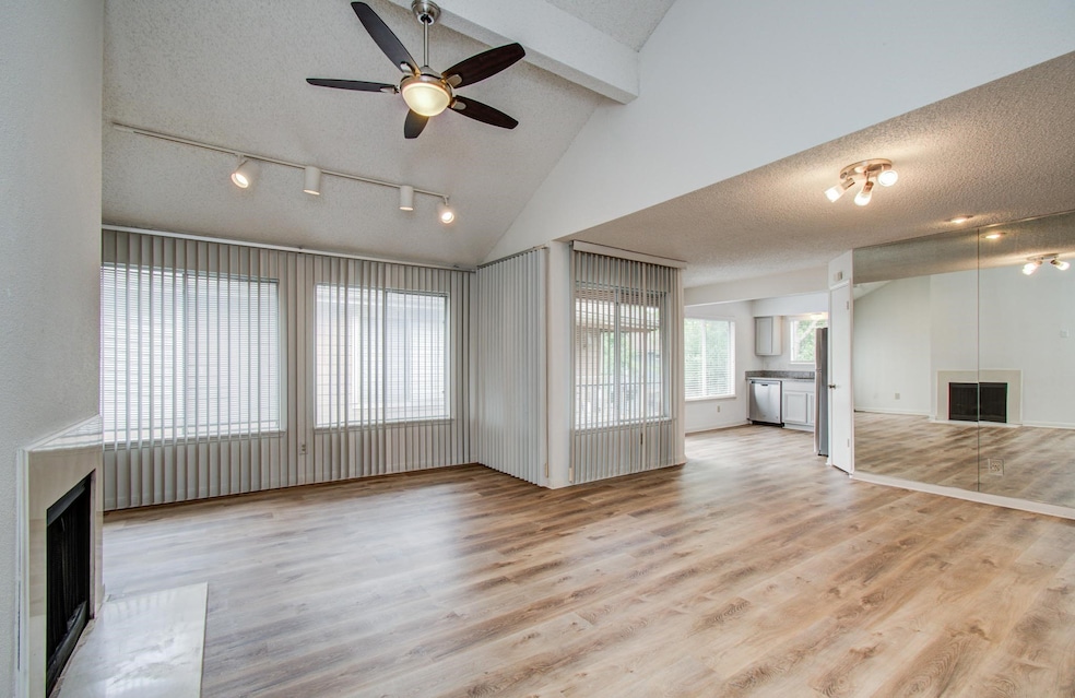 Open concept living room with cozy wood burning fi