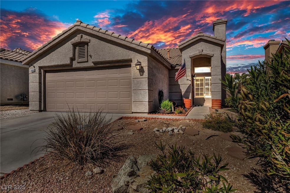 Mediterranean / spanish home with driveway, a tile