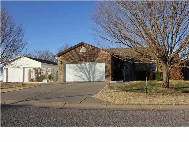 Front view including detached garage