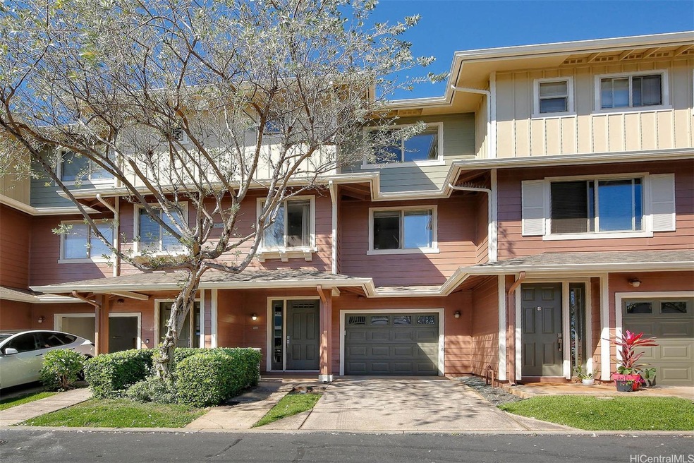 Three-story townhouse including driveway and 1-car