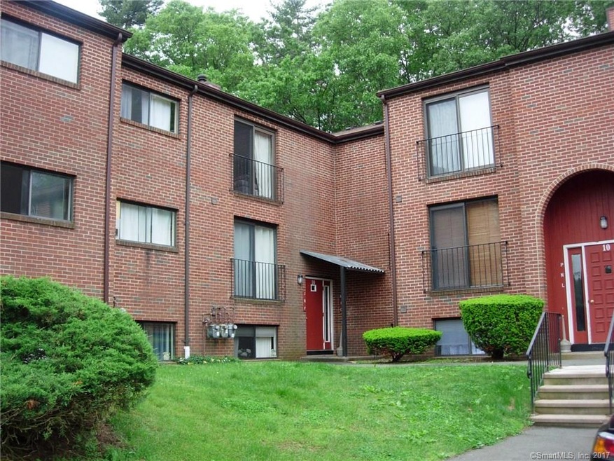 Condo entrance via corner door shown. up half a fl