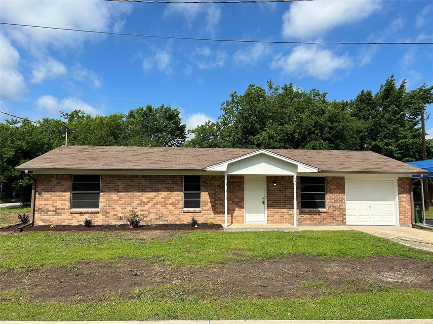 Single story home featuring a garage