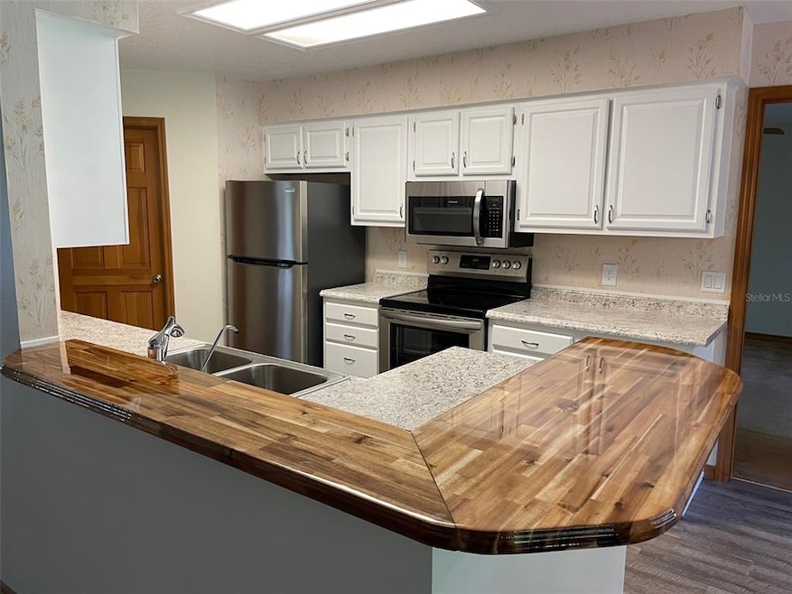 FRESHLY UPDATED KITCHEN OVERLOOKING LIVING ROOM & 