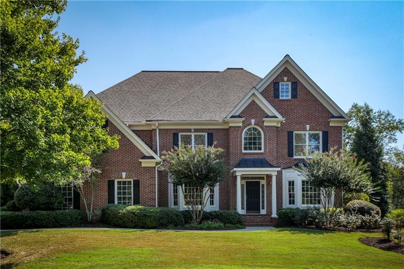 Handsome brick home with private, level backyard -