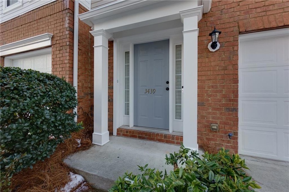 View of exterior entry with brick siding