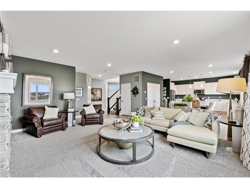 Welcome to The Springfield. This spacious and open main level seamlessly connects to the kitchen area, perfect for entertaining. It also features many large windows providing abundant natural light. (Images of Model Plan, Finishes Will Vary)