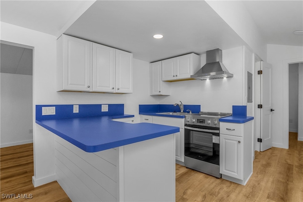 Kitchen featuring stainless steel electric stove,