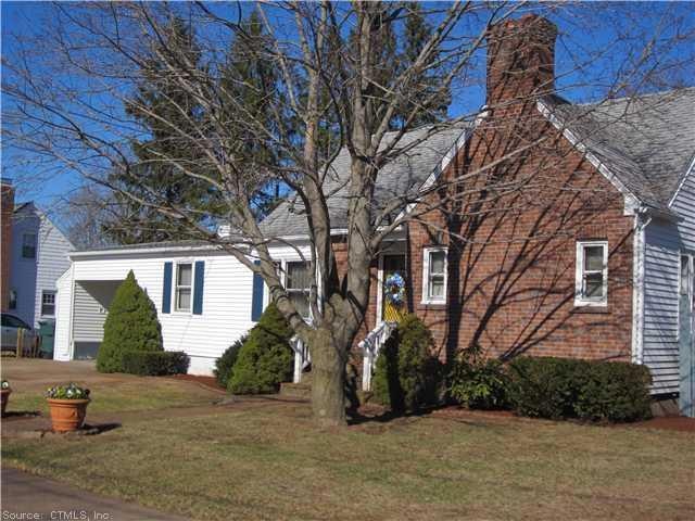 Exterior Front. New Vinyl siding, Brick front, car