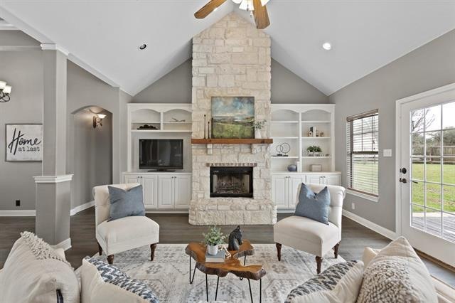 Limestone fireplace with built in book cases add c