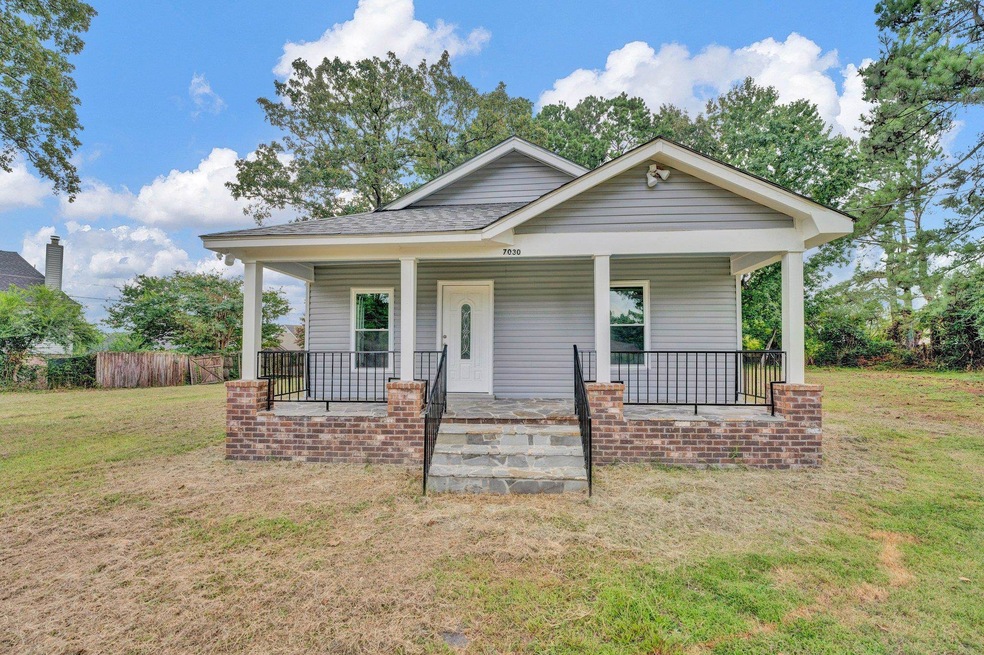 Bungalow-style home with covered porch and a front