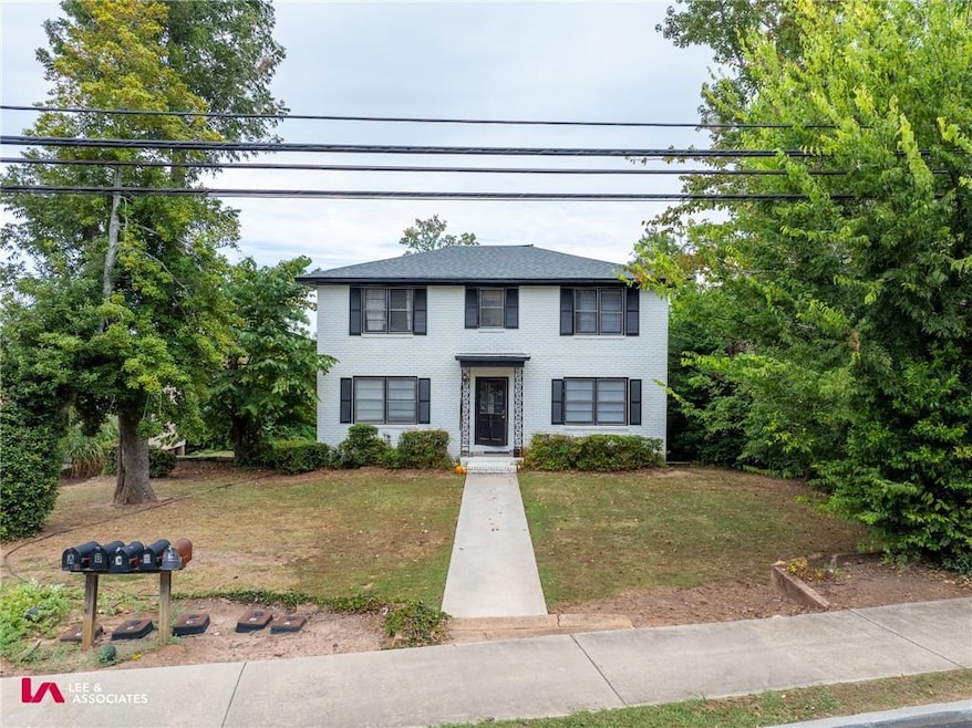 View of front of property featuring a front yard