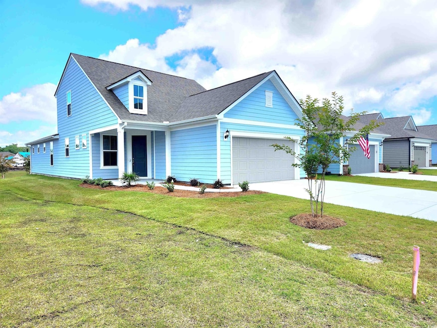 View of front facade with a garage and a front yar