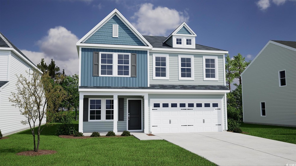View of front facade featuring driveway, a front l