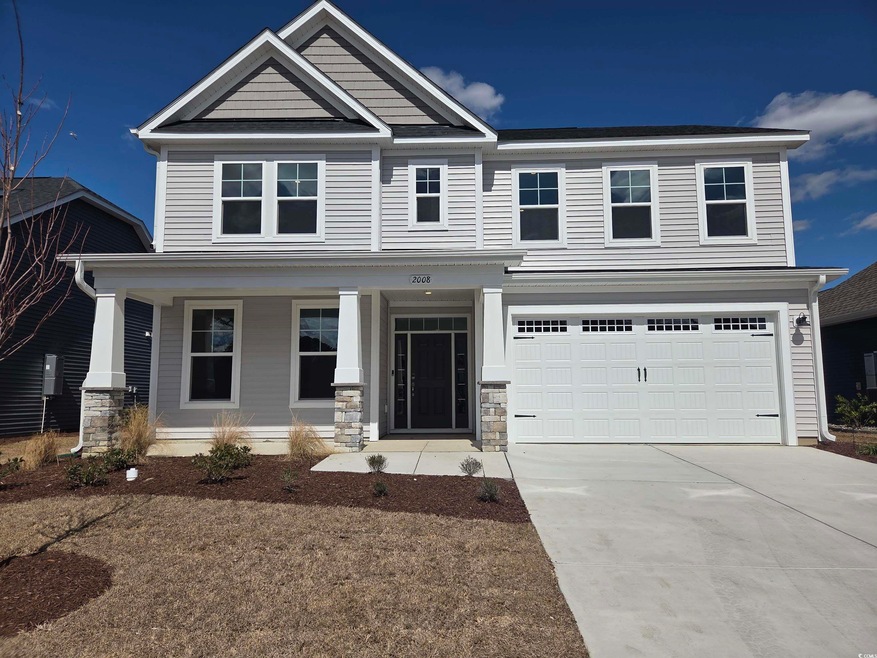 Craftsman-style home featuring a garage, covered p