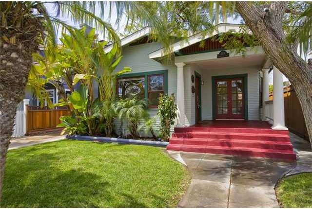 Tropical landscaping adds to the charm. Entry to Living room and dining off main front patio.