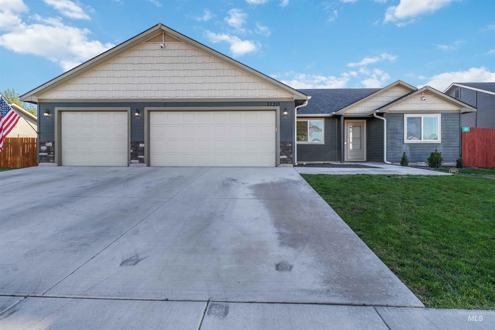 Ranch-style house featuring concrete driveway, a garage, and stone siding