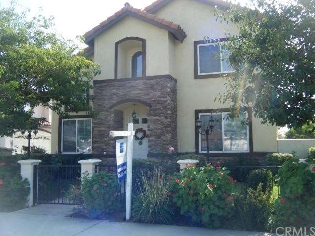 Beautiful gated front yard.
