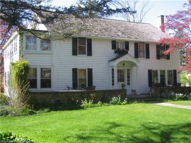 Exterior Front. South facing entrance and blus sto