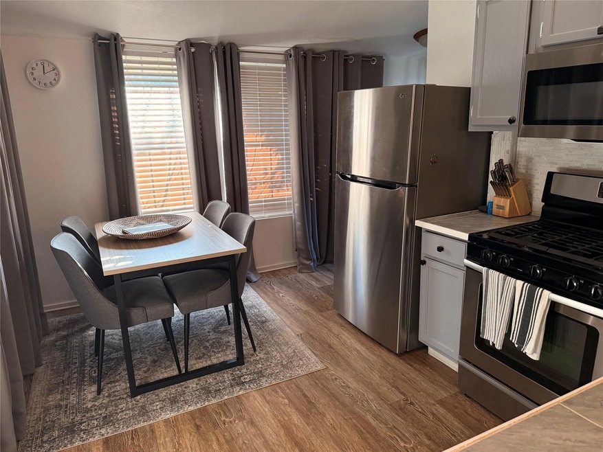 Kitchen featuring stainless steel appliances and l